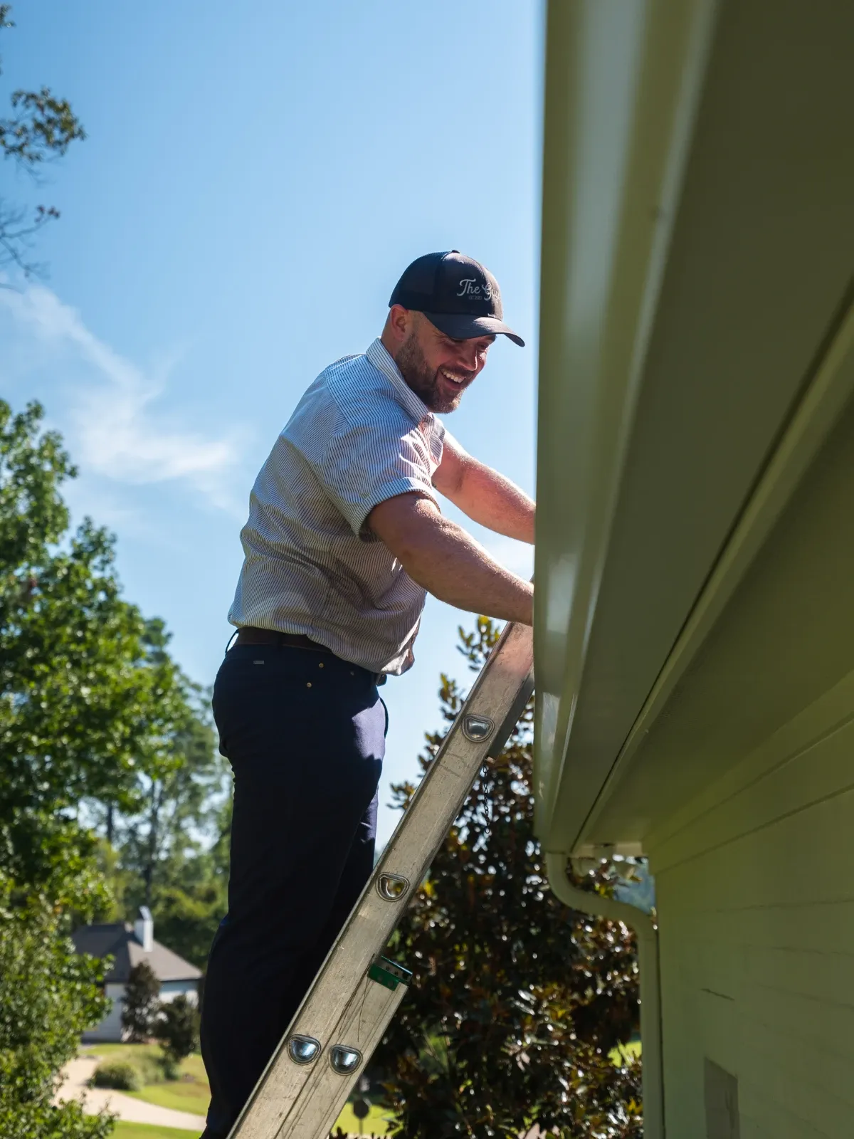 Pressure washing technician at work — The Guys Exterior Cleaning